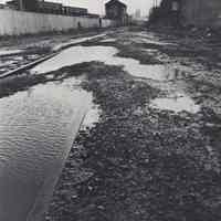 Reference image of printed photo image of Hoboken Shore Railroad right-of-way & track from pg 33 of archives catalog 2002.026.0002, Hoboken, ca. 1975.