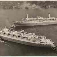 B+W photo of Rotterdam & Nieuw Amsterdam maneuvered by Moran tugs near 5th St. Pier, Hoboken, n.d., ca. 1959-1961.