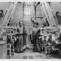 B+W photo of 2 men in engine room of unknown vessel, Hoboken, no date, ca. 1940.