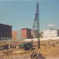 Image: color photo of a pile driver on the construction site of Marine View Towers, Hoboken, no date, ca. 1970.