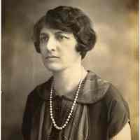 Digital image of photo of a woman posed in studio wearing pearl or bead necklace, no place (Hoboken?), no date, circa 1915-1930.