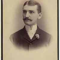 Cabinet photo of unidentified moustached man posed in photographer