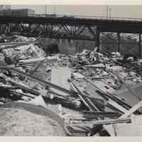 B+W photo of debris at 13th and Madison Streets with 14th St. viaduct in the background, Hoboken, no date, ca. 1970-1980.