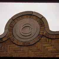          Color slide of close-up view of brick pediment reading 