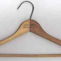 Wooden clothes hanger from the Globe Hotel, 51 Washington St., Hoboken, no date, circa 1950-1968.