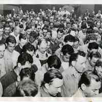 B+W photo of Todd Shipyards workers praying for military forces on D-Day, Hoboken, June 6, 1944.