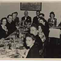 B+W photos, 2, of dinner & ceremonial cake being cut at Hoboken YMCA, Hoboken, n.d., ca. 1946-1950.