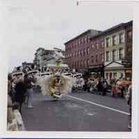 Color photos, 2, of a parade in 500 block of Washington St., Hoboken, n.d., ca. 1965-1975.