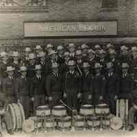 Digital image of b+w photo of American Legion Post 107 (Hoboken) Drum & Bugle Corp posed outside the post, Hoboken, [1948].