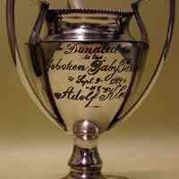Silver trophy given to Mildred Marion "Molly" Pescatore, Sept. 9, 1914, as a prize in the 1914 Hoboken Baby Parade.