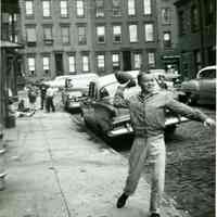 B+W photo of Tommy Duff throwing a football on Willow Terrace, Hoboken, no date, [1959].