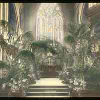 Lantern slide, color, of a church interior with floral decorations, used for promotional display in Hoboken, no date, ca. 1920.