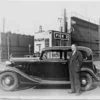 B+W photo of man in suit next to a black automobile, Pier 3, Beth Steel, Hoboken, no date, ca. 1940