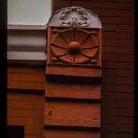 Color slide of detail view of brickwork, roundel and decorative tile at 1116 Garden between 11th and 12th