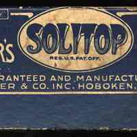          detail top panel with S. Fisher name and Hoboken, N.J., U.S.A. address
   