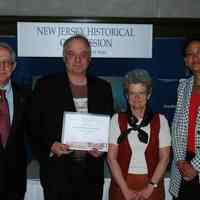 Color photo of Robert Foster, Director, Hoboken Historical Museum receiving certificate, Trenton, N.J., May 4, 2006.