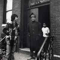 B+W photo of Tom Olivieri (left) and a Mr. Romero on the stoop of 919 Willow Ave., Hoboken, January 1975.