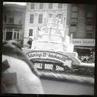          Centennial Parade, Schoning's City Hall Bake Shop float; adjusted
   