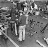 B+W photo of workers repairing main deck on unknown ship, Hoboken, no date, ca. 1940.