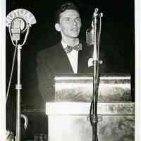 Sinatra photo: Frank Sinatra speaking at podium during "Broadway for Roosevelt" dinner, Hotel Astor, New York, Oct. 22, 1944.