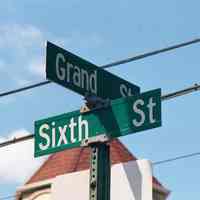 Color photo of street sign at the northwest corner of Sixth and Grand Sts. Hoboken, Sept., 1-5, 2001.