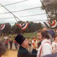 Color photo of a player and an umpire 