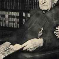 Digital image of photo of Father Mark Moeslein, Passionist, printed on 75th anniversary souvenir card, no place, November, 1945.