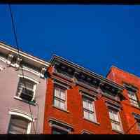 Color slide of close-up view of cornices, brackets, friezes and window heads on two buildings at an unidentified location