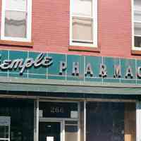 Color photo of building facade with sign for Stemple Pharmacy, 266 Seventh St. at Willow Avenue, Hoboken, Sept., 1-5, 2001.