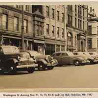 Washington St. looking north to Newark St., showing 74-76-78, 80 and 82-84 Washington St. & Hoboken City Hall, Hoboken, 1942.