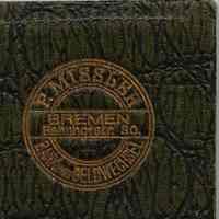          wallet: front cover detail of  stamped F. Missler logo
   