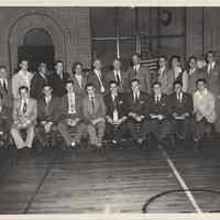 B+W photo of of a baseball team posed with trophy at Hoboken YMCA, n.d., ca. 1948-1955.