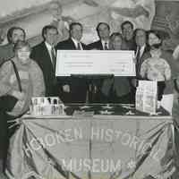 B+W photo of ceremony for presentation of grant check to Museum for building new home, Hoboken, 2000.