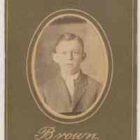 Sepia-tone photo of an unidentified boy posed in studio, Hoboken, no date, ca. 1890-1910.