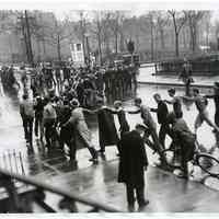 B+W photo of Stevens Institute students in snake line celebrating legalization of 3.2 pct beer, at 4th & Hudson Sts., Hoboken, Apr. 7, 1933.