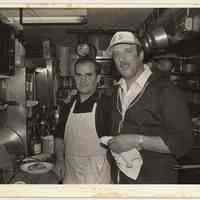 B+W photo of 2 men in restaurant kitchen, River Street, Hoboken, n.d, ca. 1983-1988.