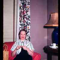 Color slide of Anita Heimbruch sitting on a chair.