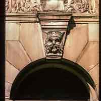 Color slide of close-up view of portico keystone, semicircular arch and transom window on one of the buildings between 1110 and 1120 Washington between 11th and 12th