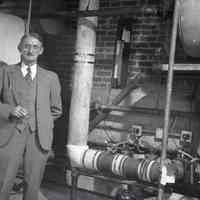 Digital image of B+W negative image of Julius Durstewitz (left) & unidentified man in boiler room, Hoboken. no date, circa 1938-1940.