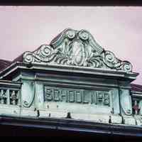 Color slide of close-up view of pediment and frieze reading "School No 8" on Public School No. 8 (Leinkauf School) at 450 7th between Jefferson and Adams