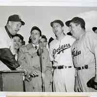 Sinatra photo: Frank Sinatra with baseball players and managers at Ebbets Field, Brooklyn, for war benefit event, n.d., ca. April 14, 1944.
