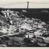 B+W photo of debris at 13th and Madison Streets with 14th St. viaduct in the background, Hoboken, no date, ca. 1970-1980.