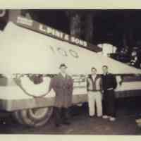 B+W photos, 2, of L. Pini & Sons parade float with giant pipe wrench on trailer for March 28, 1955 Hoboken Centennial Parade.