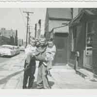 B+W photo of 3 boys playing on Clinton Street near Willow Terrace, Hoboken, Easter, [1959].