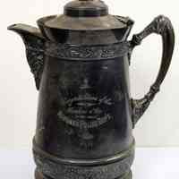 Silver water pitcher presented to a Hoboken Police officer in 1893 recognition of 25 years of service.