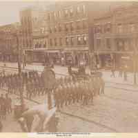 Sepia-tone photo of funeral procession for policeman, Washington St. between Third and Fourth Sts., Hoboken, ca. 1903.