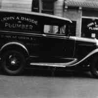 B+W photo negatives of two business photos of John A. Rhode, Plumber, 96 Park Ave., Hoboken. N.d., ca. 1940-1950.