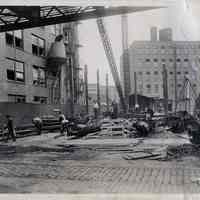 B+W photo of erection of steel frame for new factory building at R. Neumann & Co., Ferry St. west of Willow Ave., Hoboken, Aug. 8, 1919.