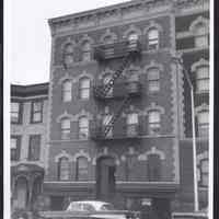 B&W photo of mixed-use row house apartment building at 390 Central Avenue, Newark.
