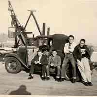 B+W photo of 5 men posed in or on a car at a Hoboken pier head, Hoboken, 1953?